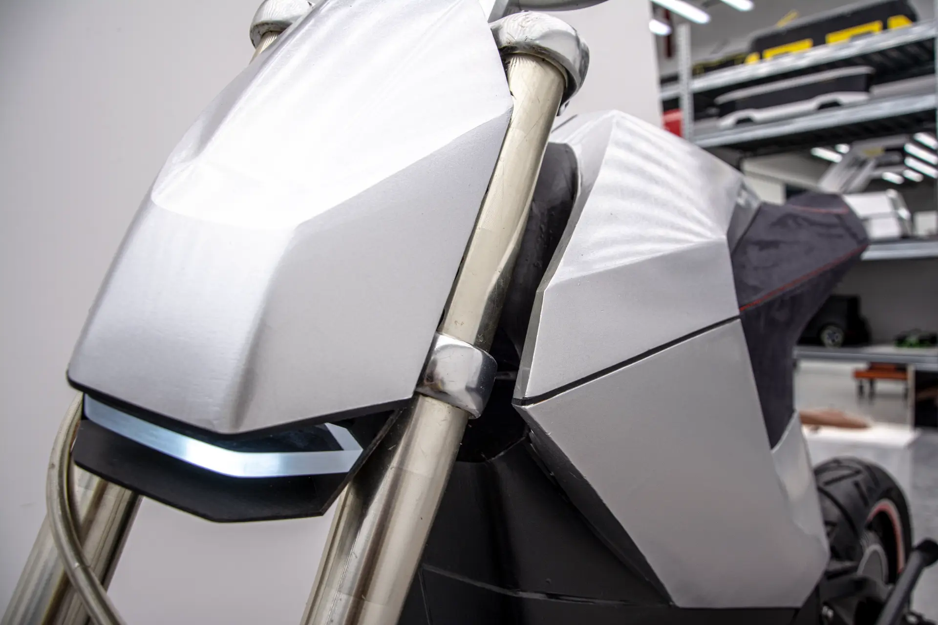 Close-up detail of the E-moto front fairing and headlight