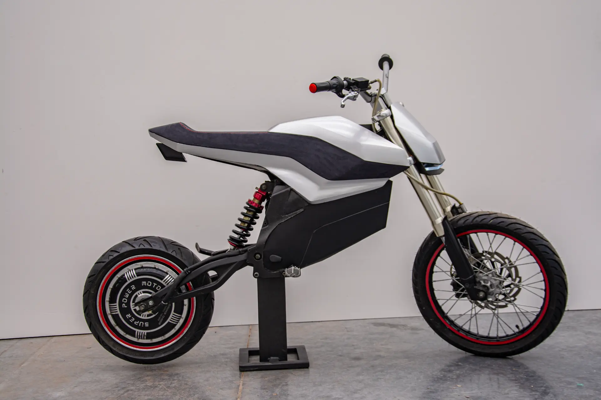 Rear three-quarter studio view of the E-moto prototype